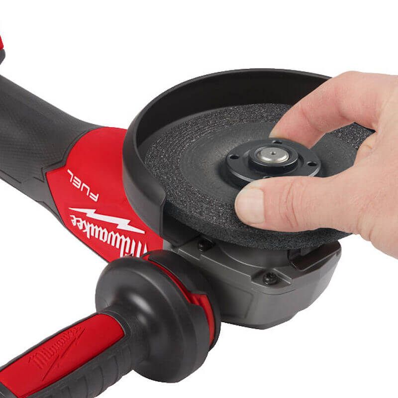 Close-up of Milwaukee M18 FUEL Cordless Angle Grinder showing the disc attachment area