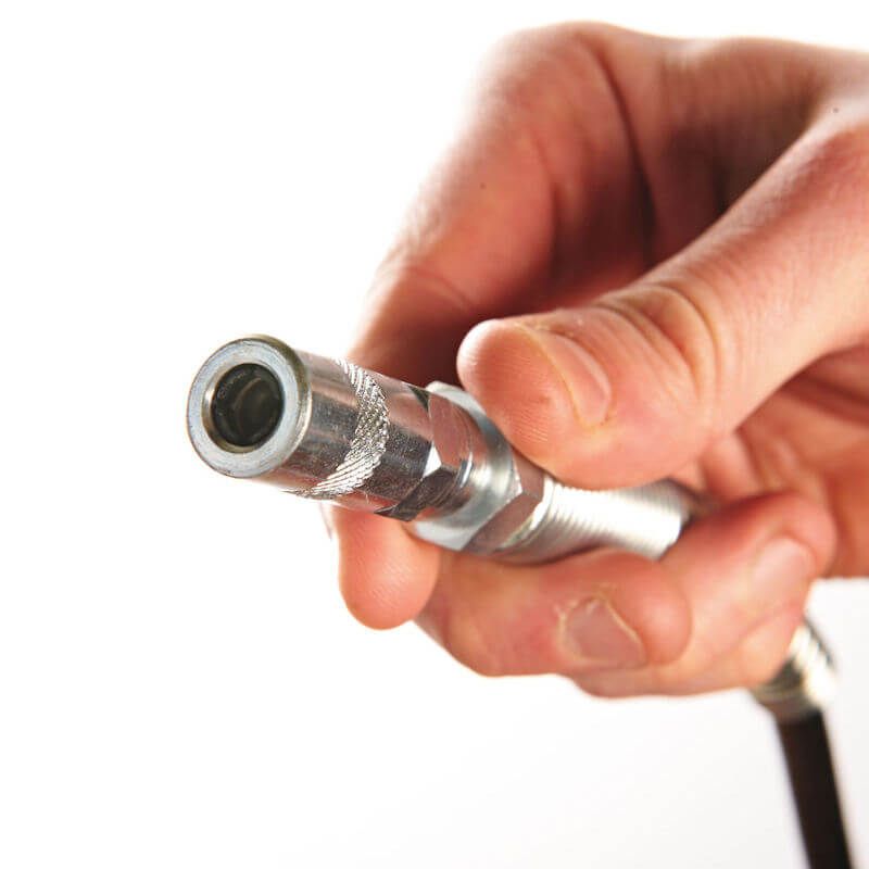 Close-up of Milwaukee M18 grease gun nozzle